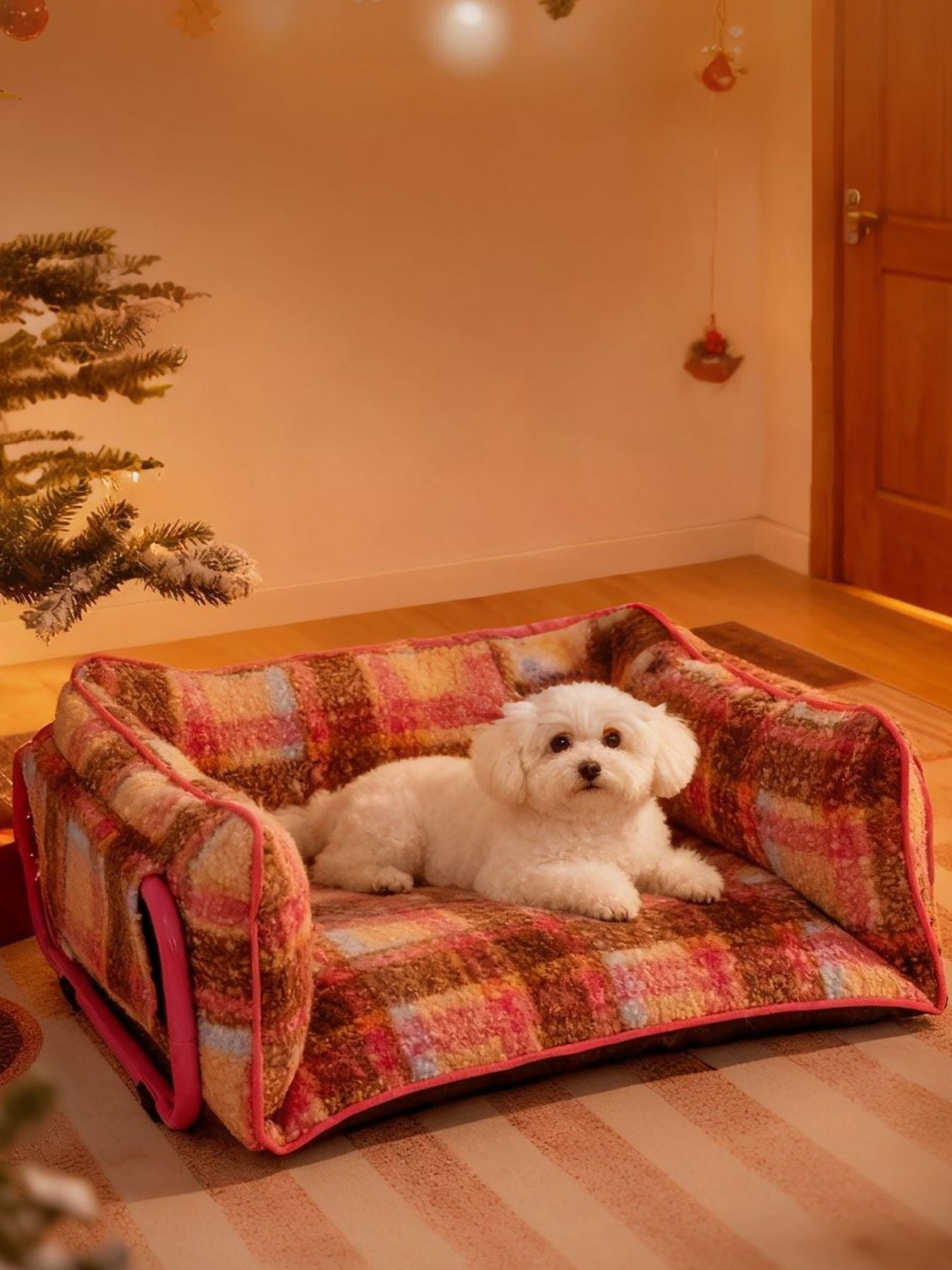 Plüsch-Pet-Sofa mit Karomuster, pinken Seitenpolstern; Hund liegt mittig
