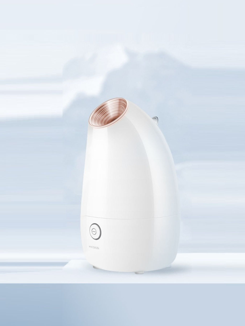 White facial steamer with rose-gold steam outlet nozzle
