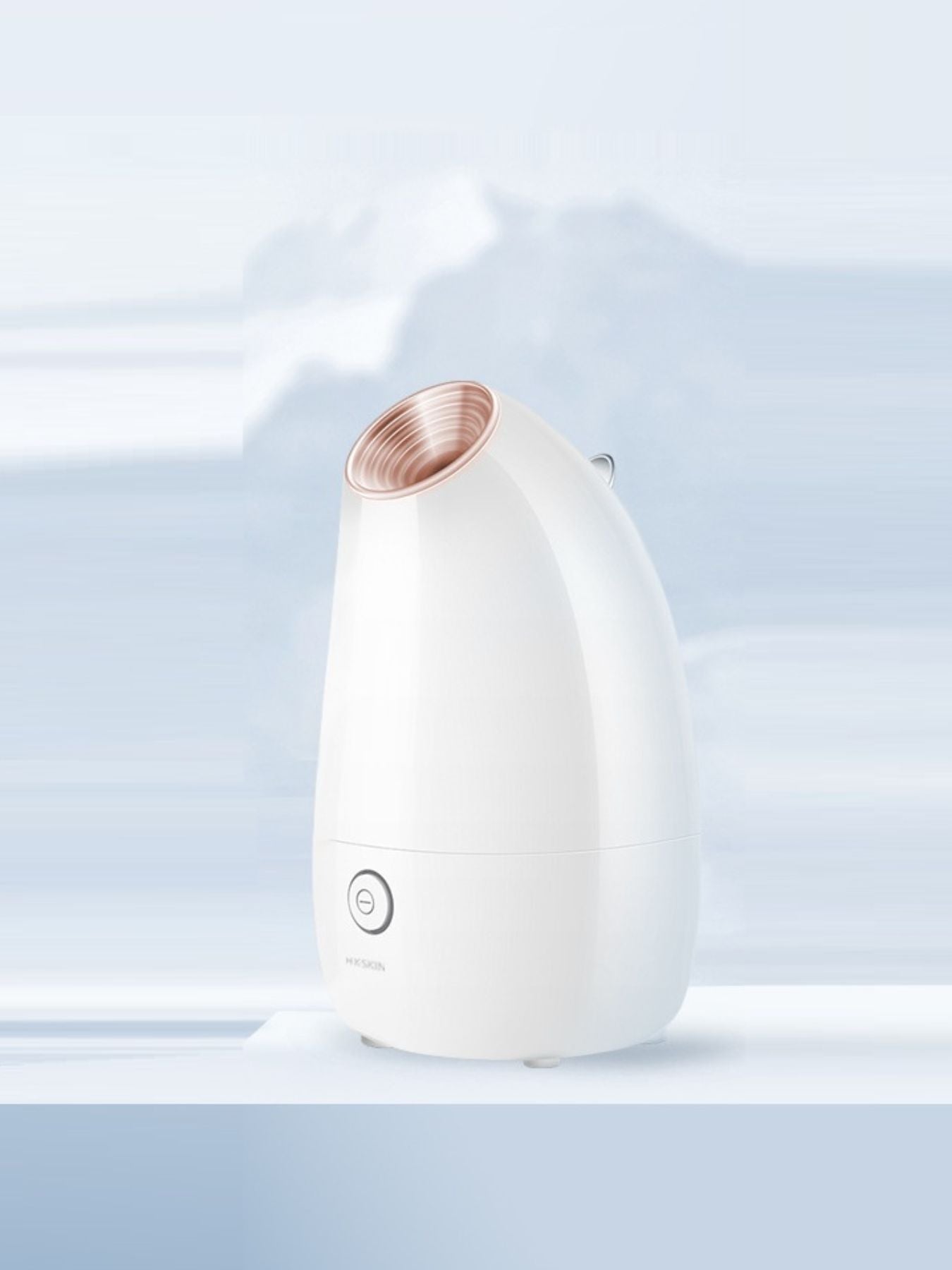 White facial steamer with rose-gold steam outlet nozzle