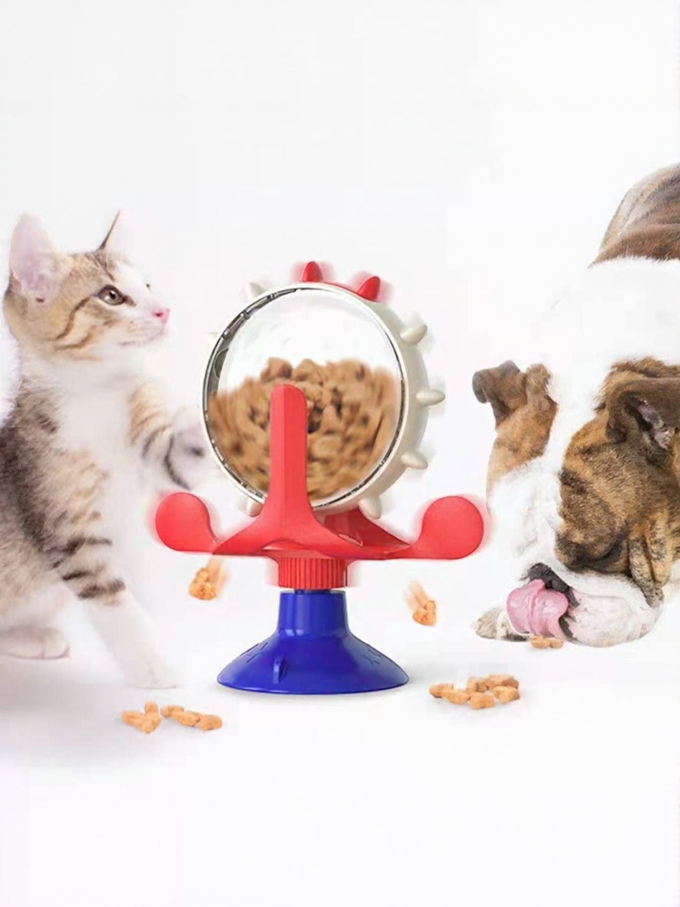 Interactive rotating cat treat toy with clear dome, red arms, and blue base