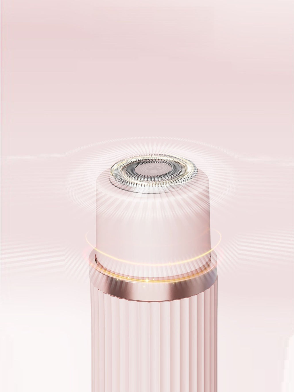 Close-up of round foil head on a blush pink epilator top