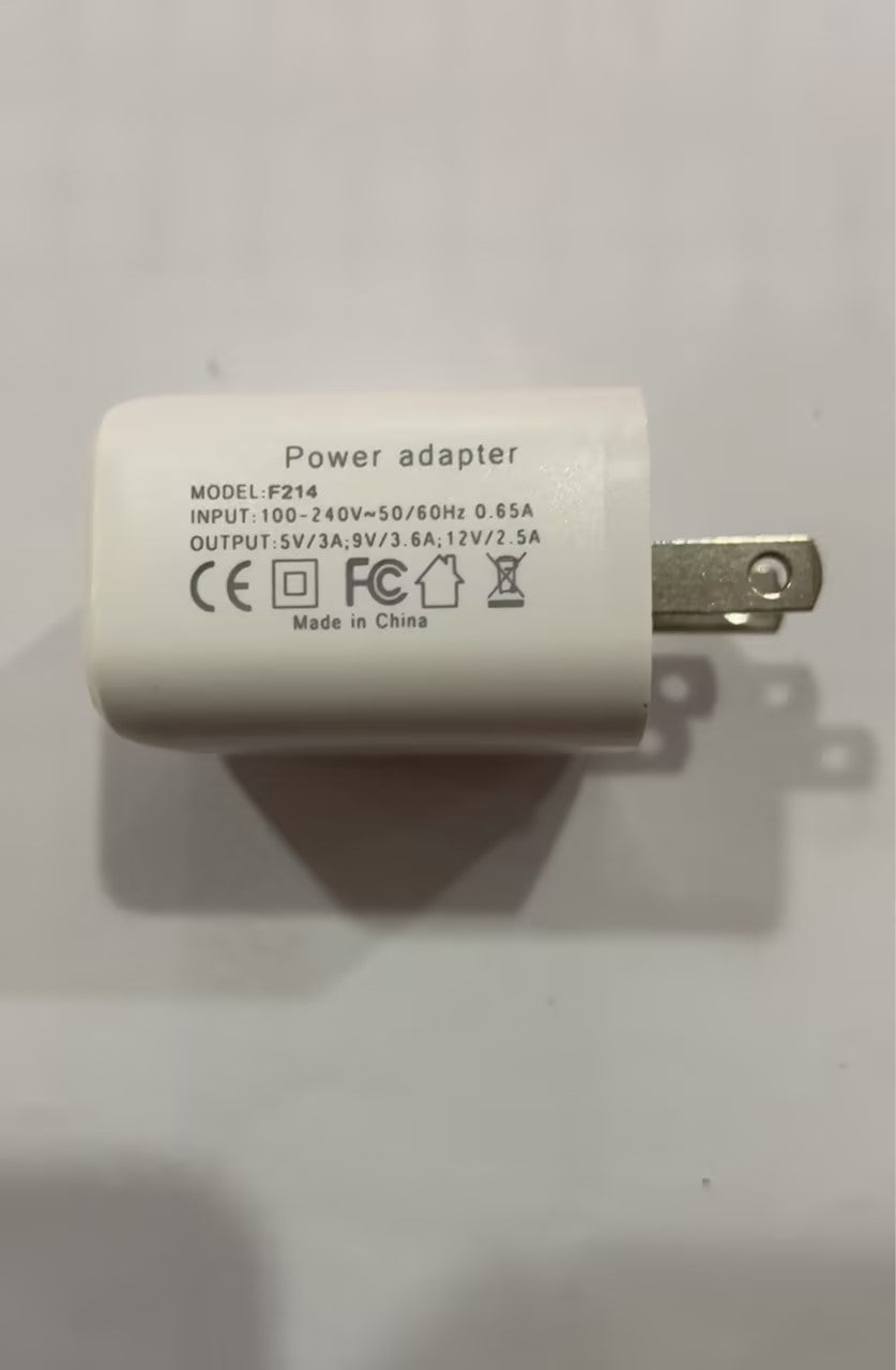 White power adapter with single two-prong plug, CE and output details shown.
