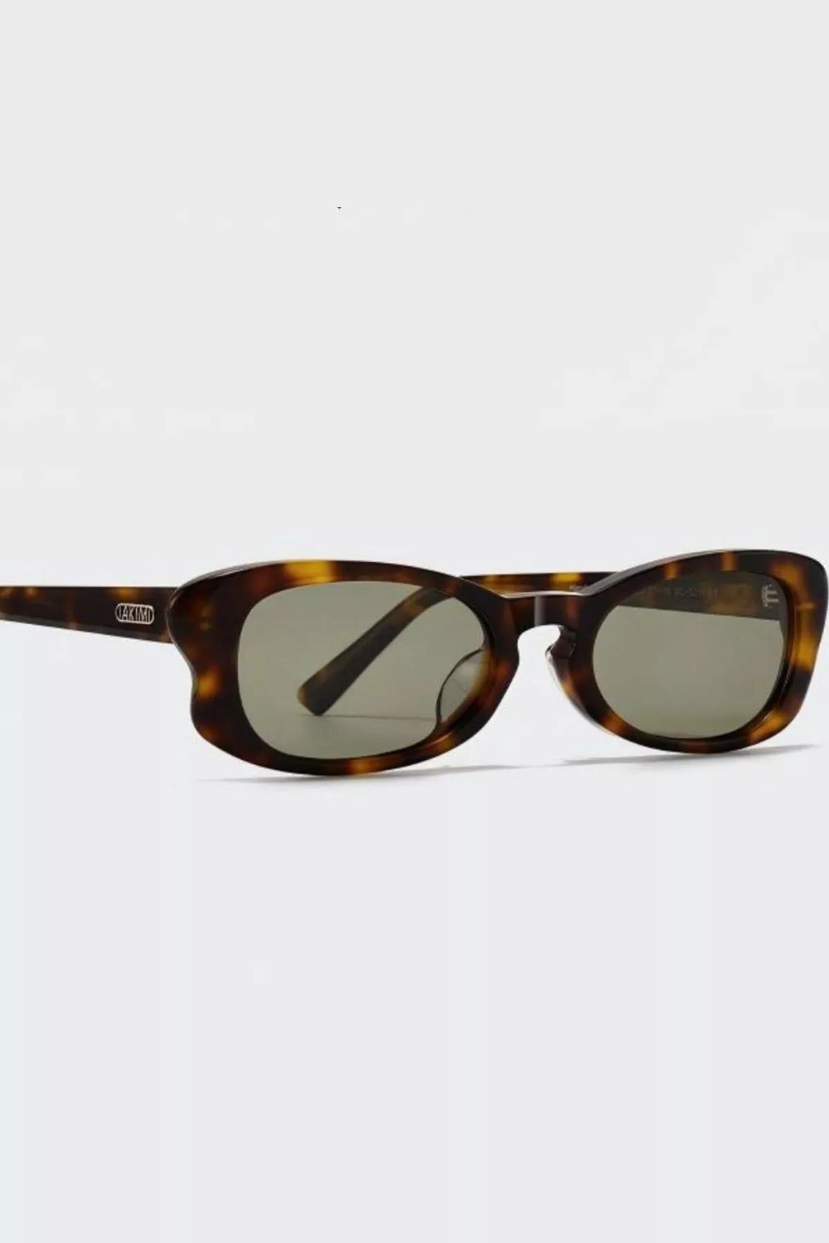 Brown tortoiseshell sunglasses, front view with oval lenses and keyhole bridge