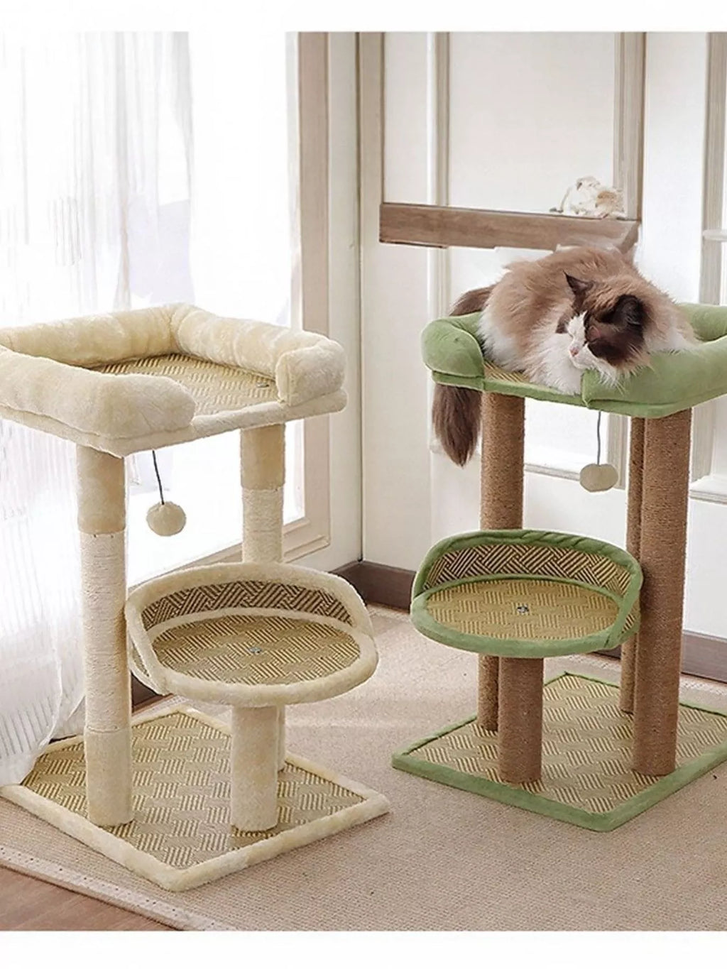 Plush cat tree condo with cream base, round sisal platforms, and green top perch