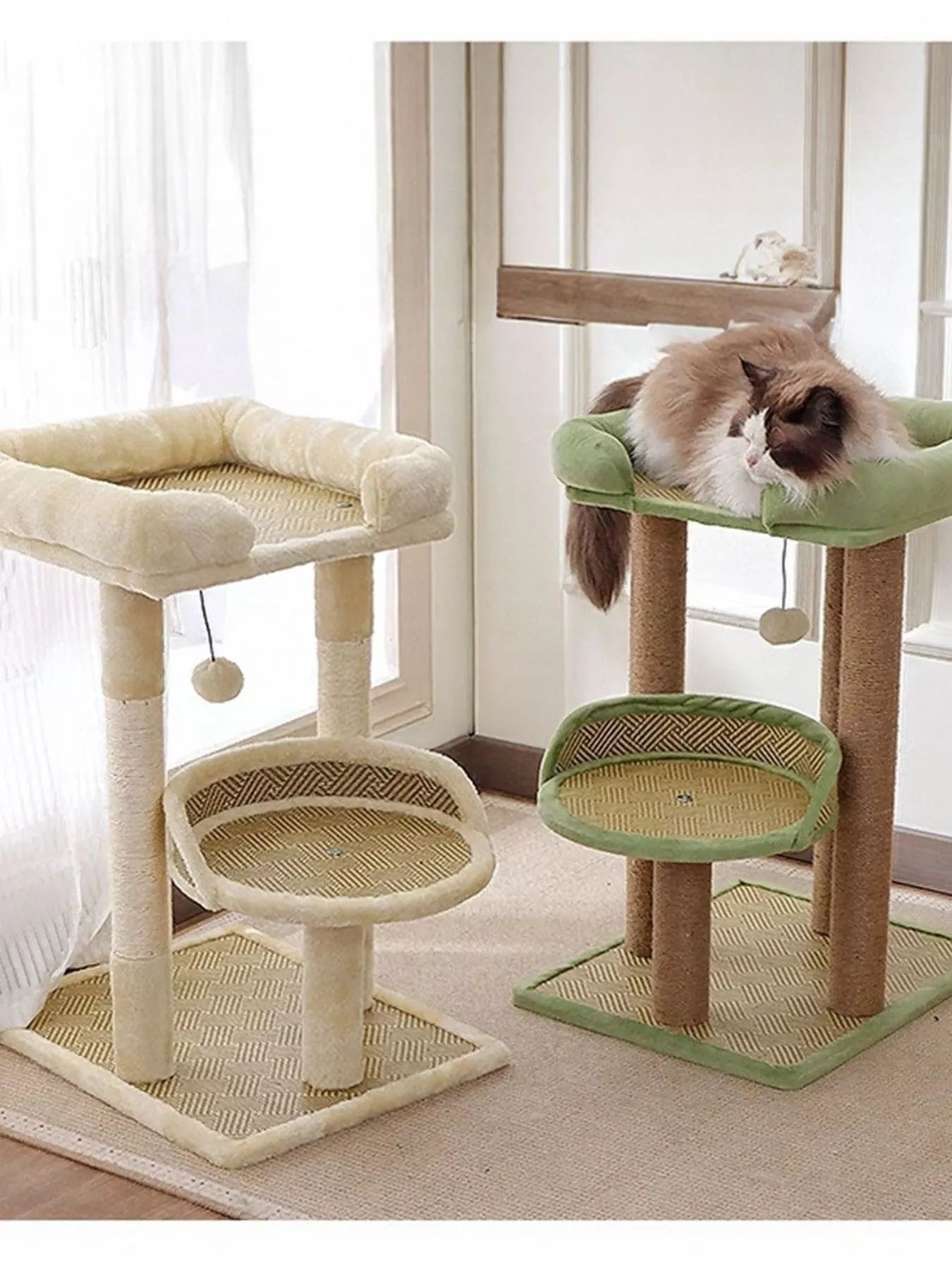 Plush cat tree condo with cream base, round sisal platforms, and green top perch