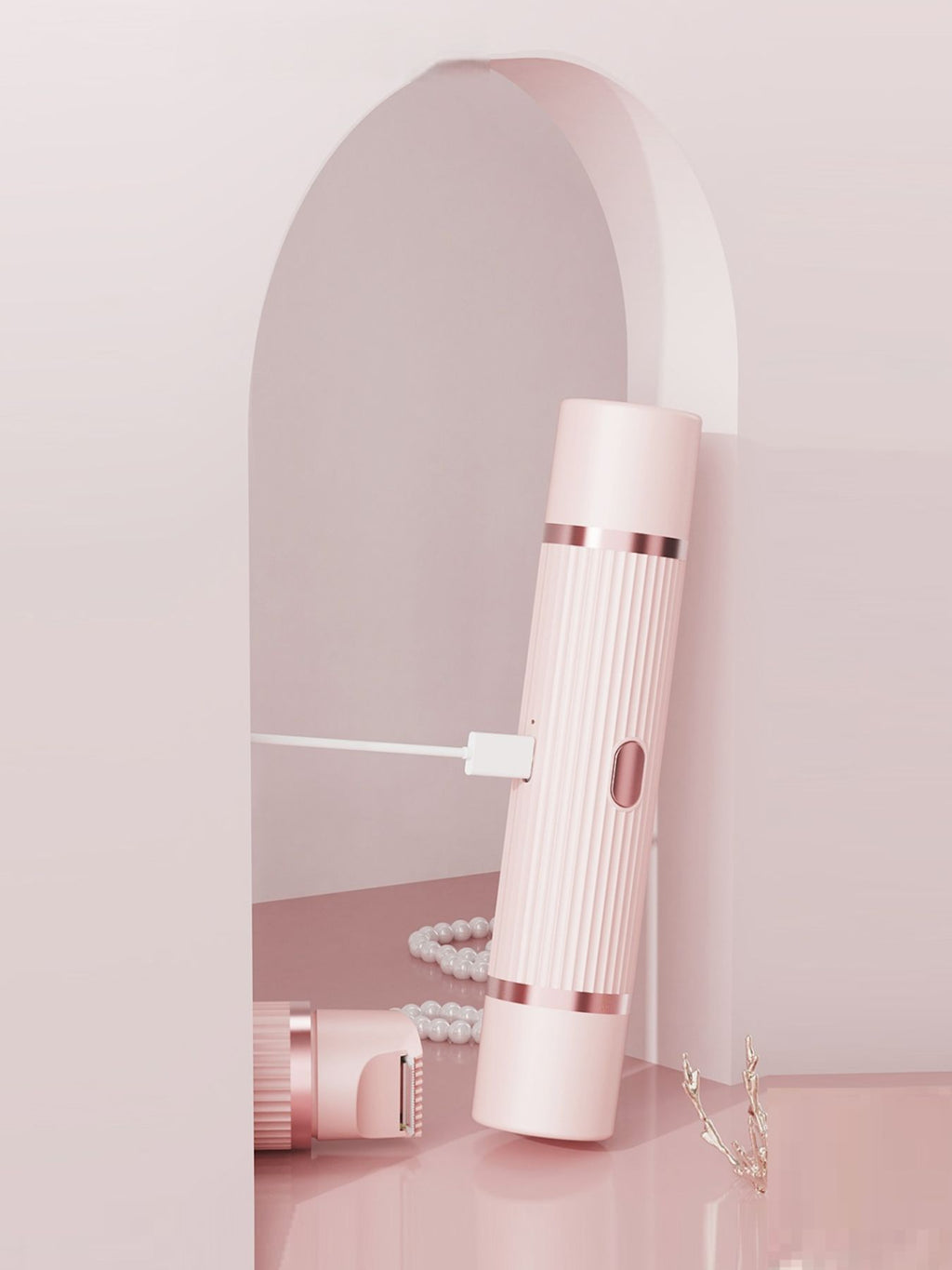 Blush pink portable hair epilator standing with a slim side tool attachment