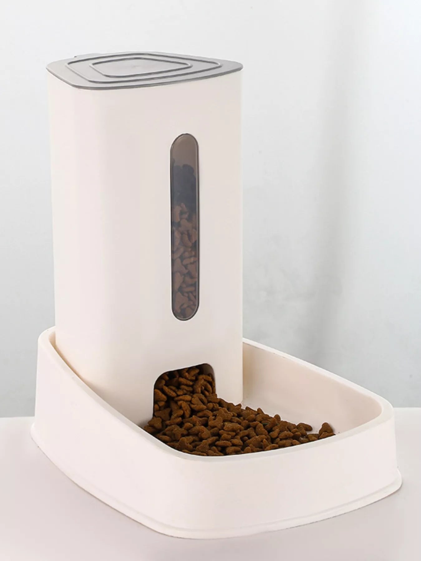 Automatic Food Dispenser Pet Bowl, White; front window with kibble in feeding bowl