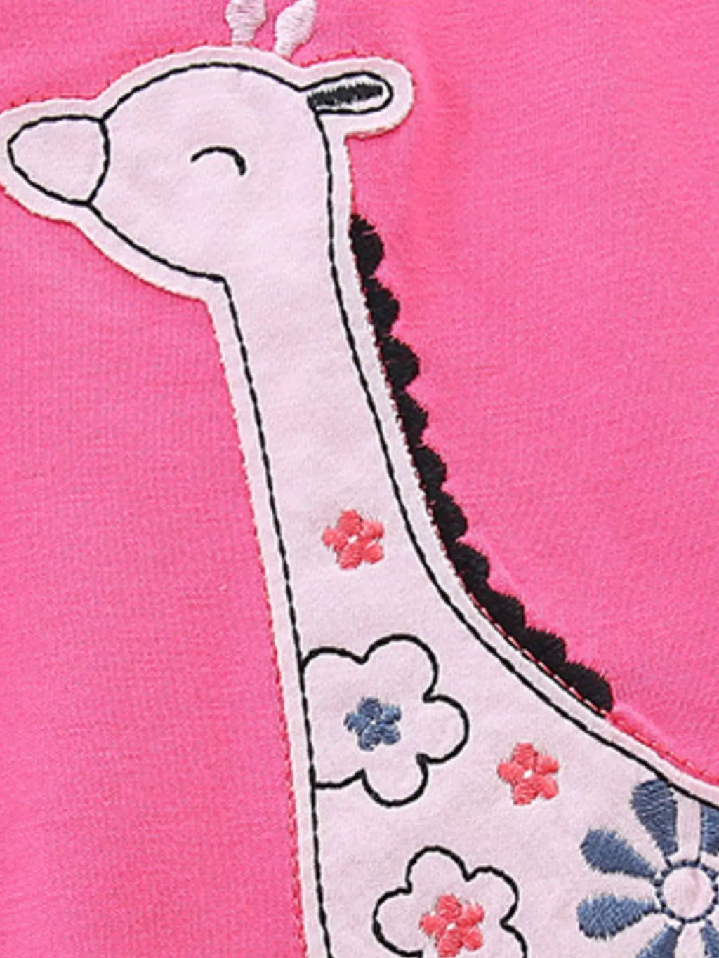 Giraffe applique patch on hot pink top with small flower and spotted details
