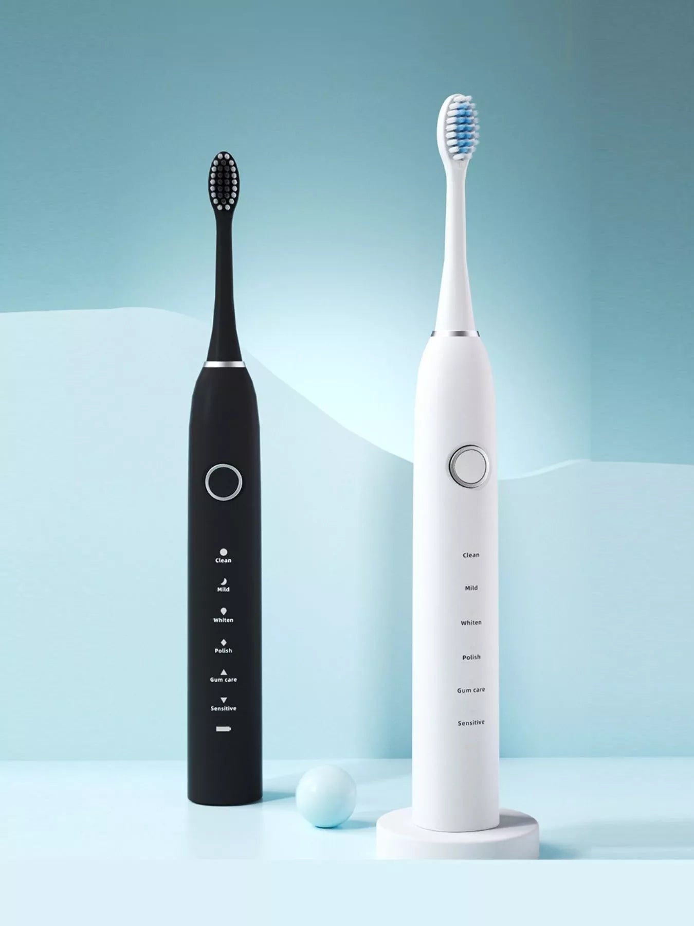 Black and white electric toothbrushes side by side with multi-mode controls