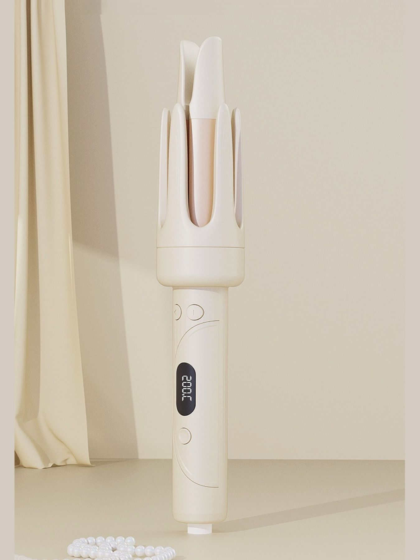 Beige automatic hair curling iron standing, front barrels and illuminated control panel