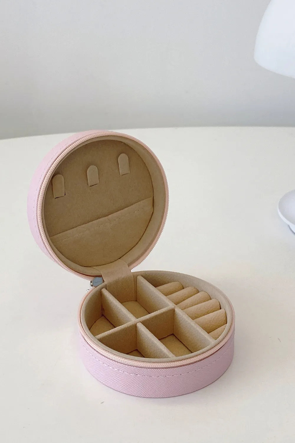 Blush pink PU leather jewelry storage box with ring slots, open lid