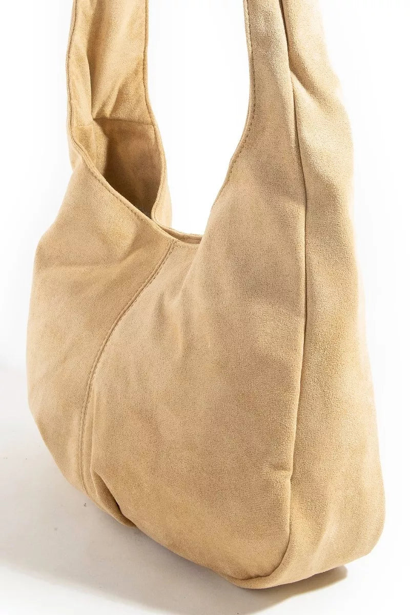 Faux suede hobo bag, light tan with studded grommet trim and curved opening