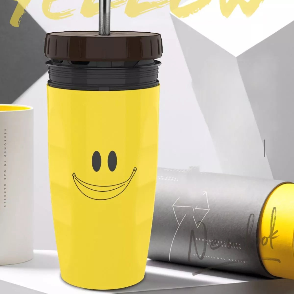Yellow Christmas tumbler kettle with smiley face design and dark brown lid