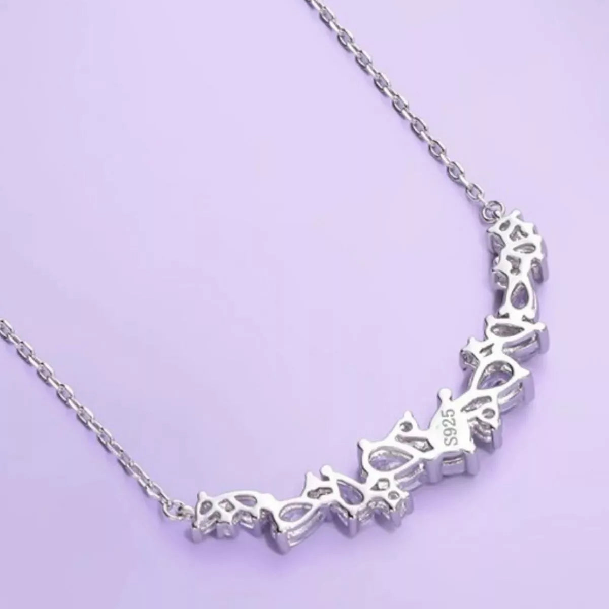 Silver 925 zircon necklace close-up of stamped row with small prong settings