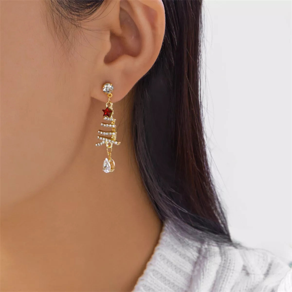 Gold-plated Christmas tree earrings with red star, rhinestone rows, and clear teardrop drops