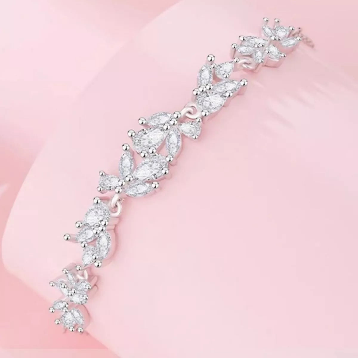 Zircon wisteria bracelet in silver tones, floral stone clusters along the band