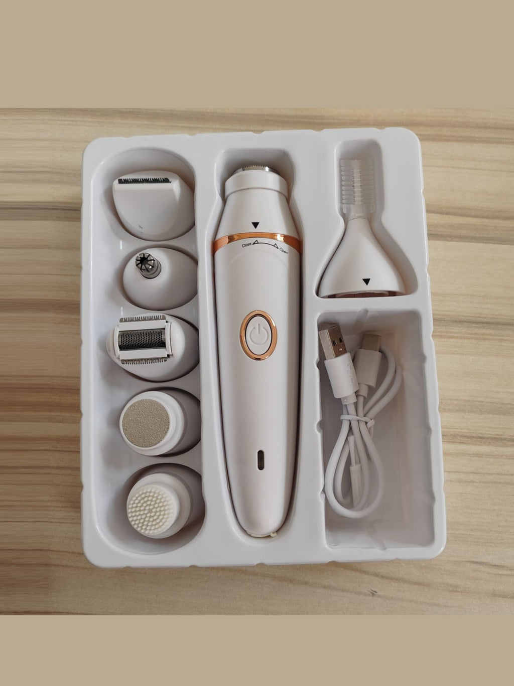 White multifunction hair removal epilator with interchangeable heads in storage tray