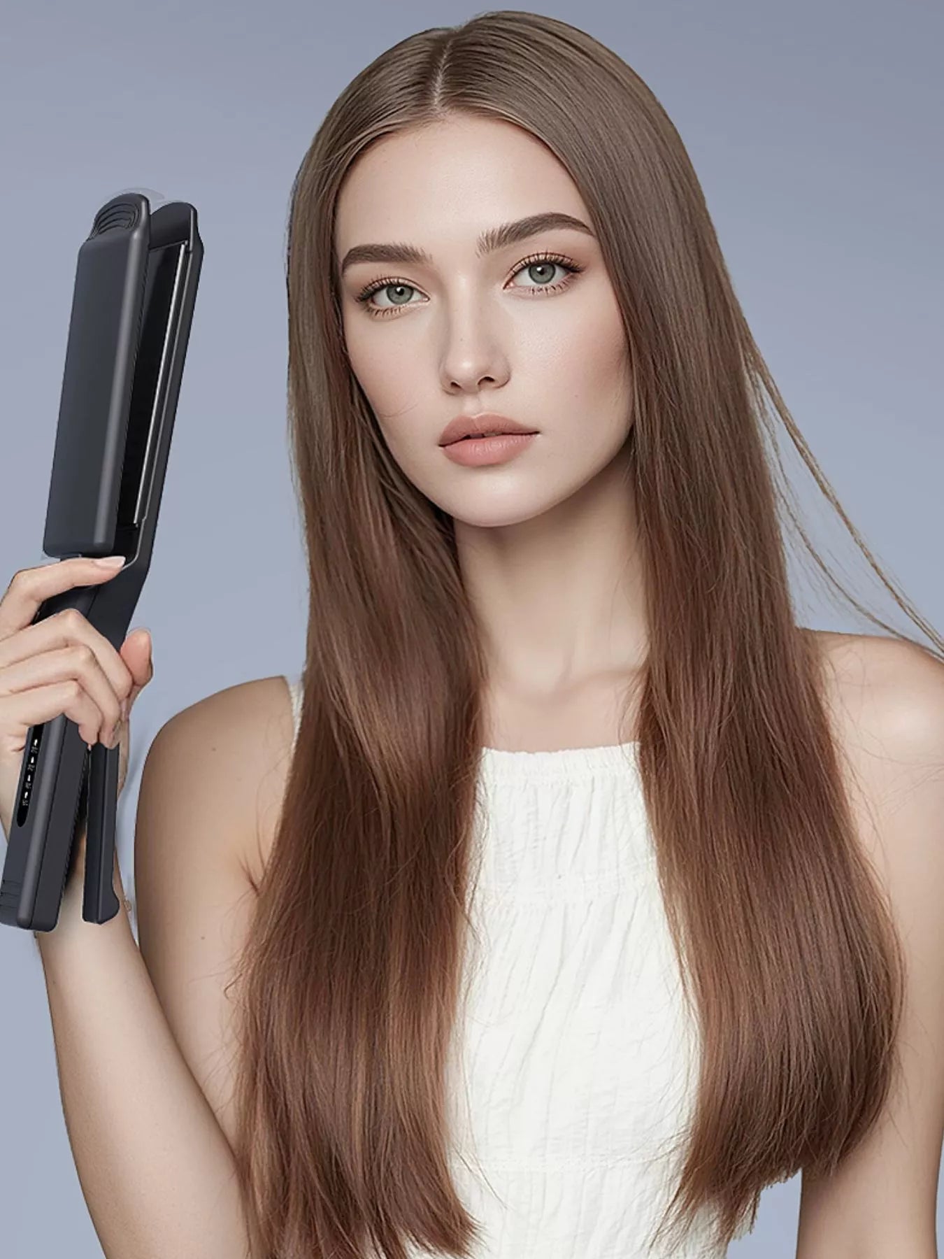 Black adjustable temperature hair straightener held in hand