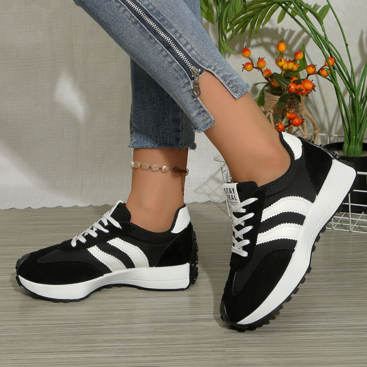 Round toe lace-up sneakers, black with white stripes and chunky sole