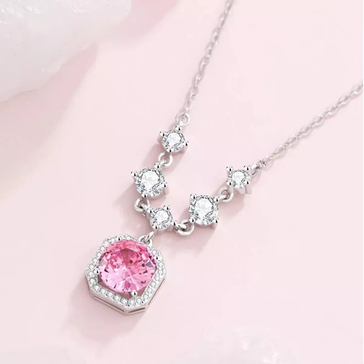 Silver chain necklace with blush pink zircon heart-shaped pendant and clear sparkle stones