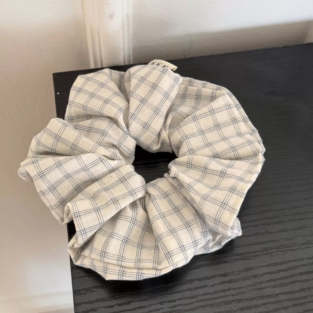 Beige plaid hair scrunchie with soft woven pattern