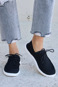 Trendsi black lace-up sneakers with round toe and white rubber sole