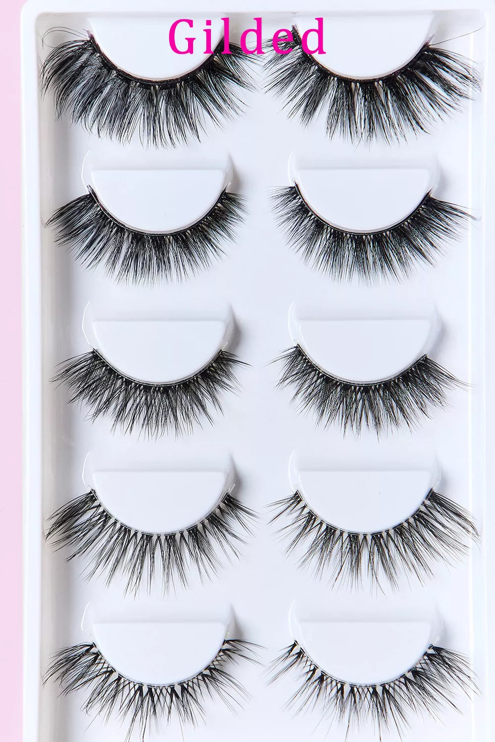 Gilded faux mink eyelashes, 4 lash pairs shown in tray