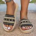 Open toe flat sandals noir avec broderie or et blanc, semelle tressée