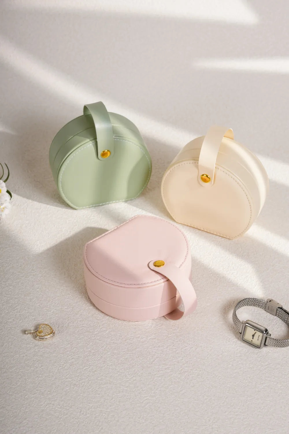 Blush pink PU leather travel jewelry box, round open case with gold snap clasp