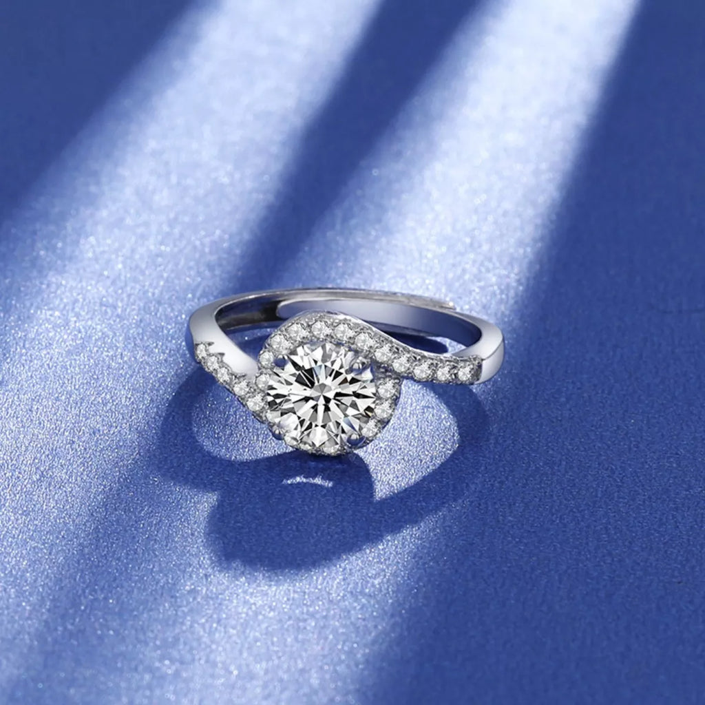 Moissanite halo ring in silver with round center stone and sparkling pavé shoulders
