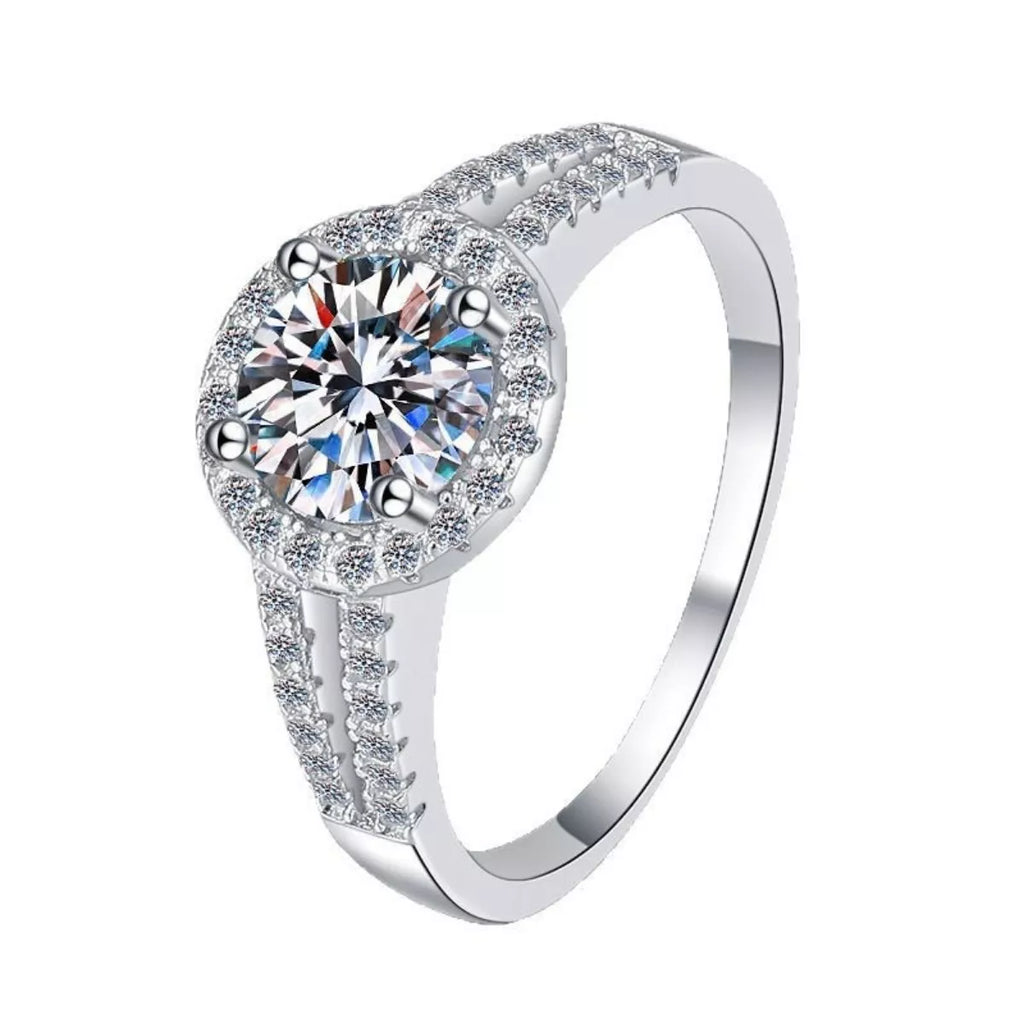 Close-up of round moissanite halo ring with detailed pavé prongs and band