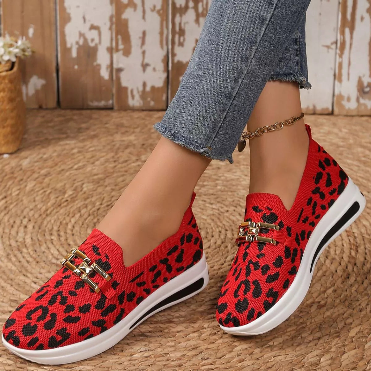Red leopard mesh slip-ons with gold buckle, white sole and ankle bracelet