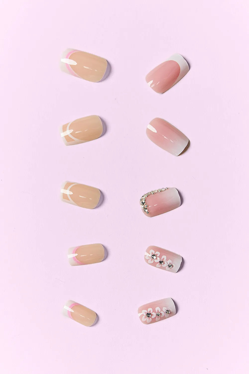 Candy Glitz press-on nails: nude tips with white French, rhinestone and flower accents