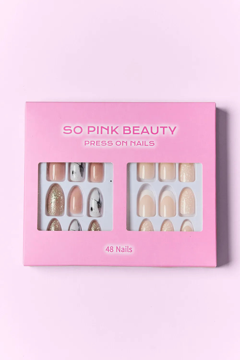 Press-on nails gift box with 48 nails, assorted nude tones, glitter, and nail art tips