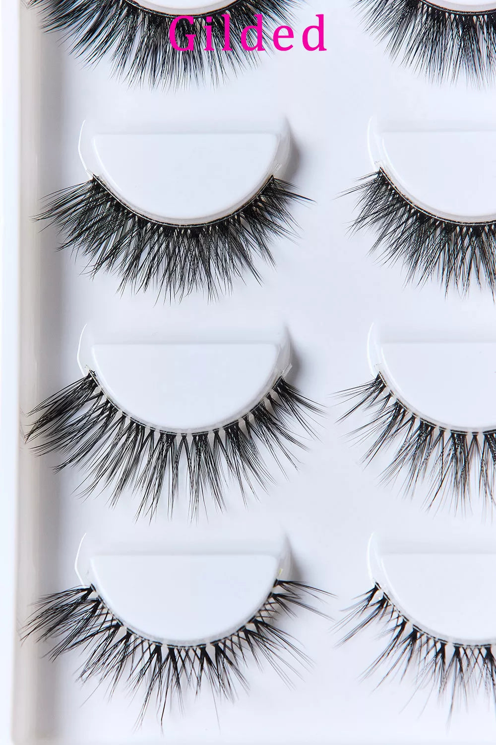 Gilded faux mink lashes with invisible band, two pairs shown