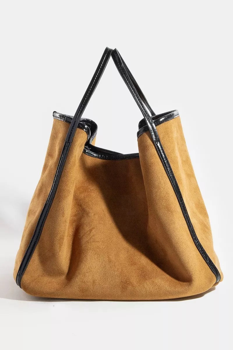 Suede tote with black faux-leather trim, open top view and side seam details, tan.
