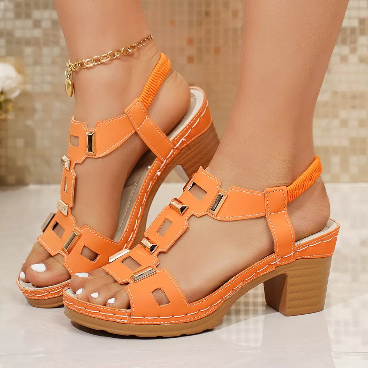Open-toe block heel sandals, orange straps with metallic buckles and open toe