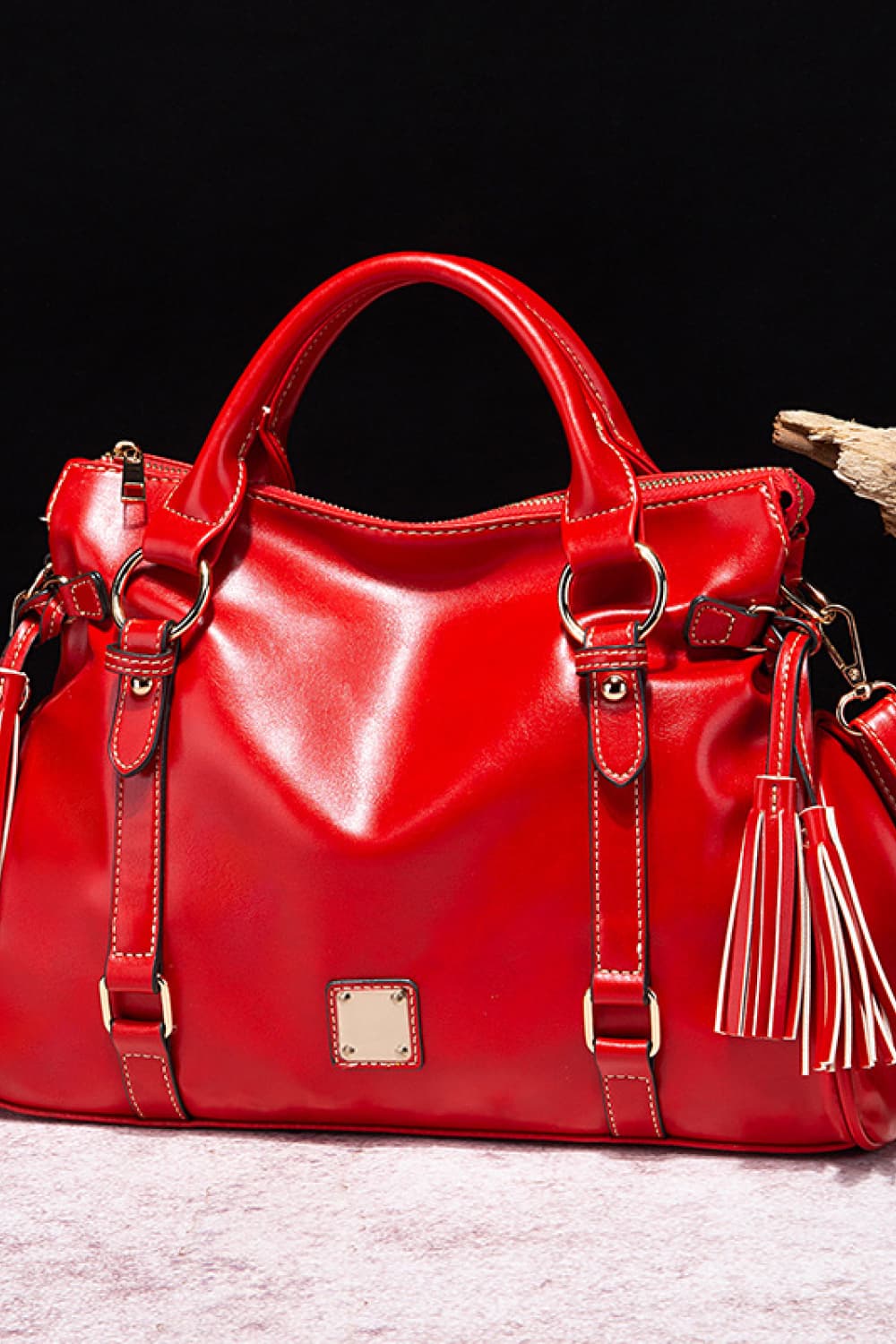 Red PU leather handbag with tassels, top handles and front buckle