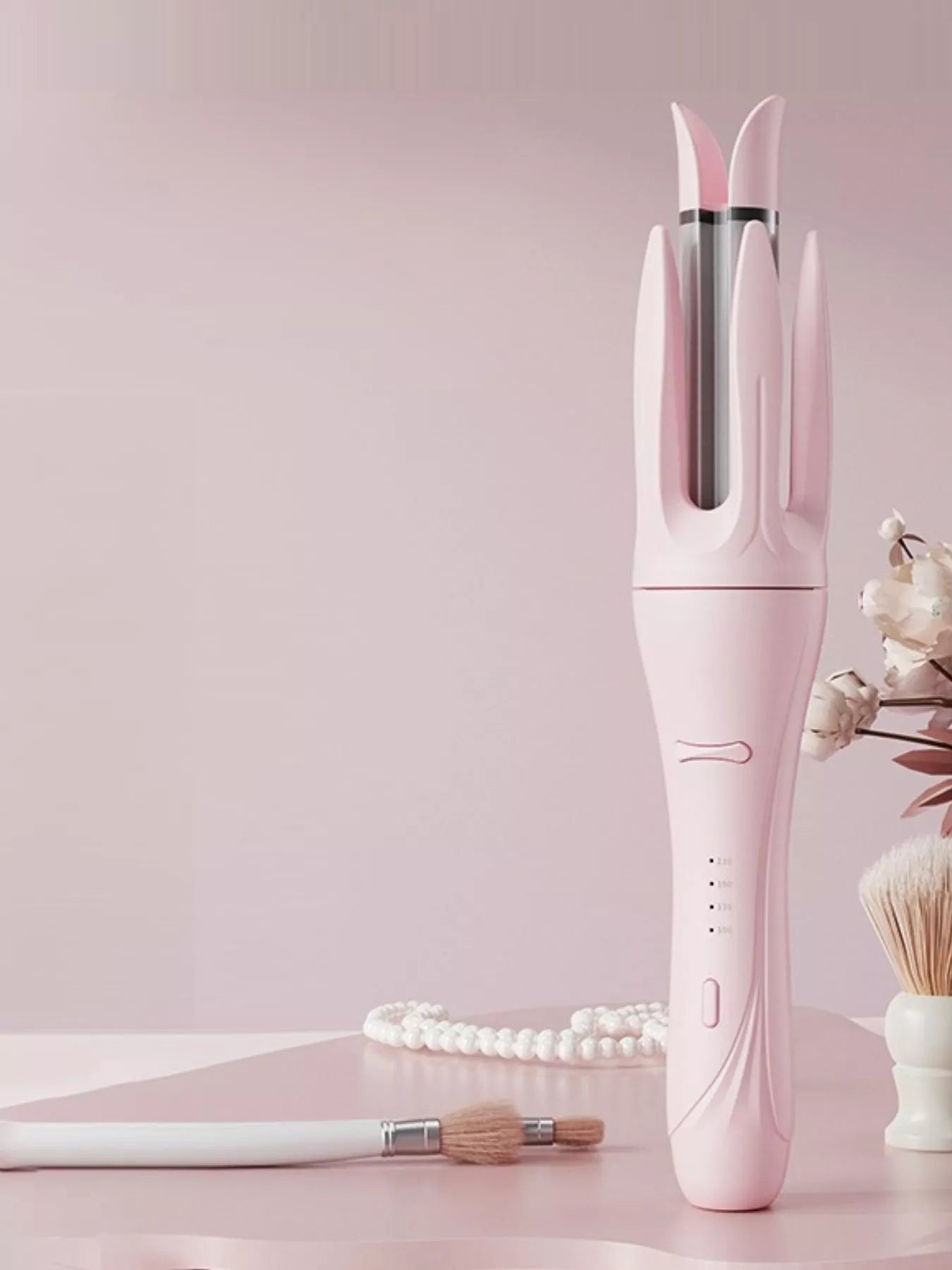 Blush Pink automatic rotating ceramic curling iron, side angle showing control buttons