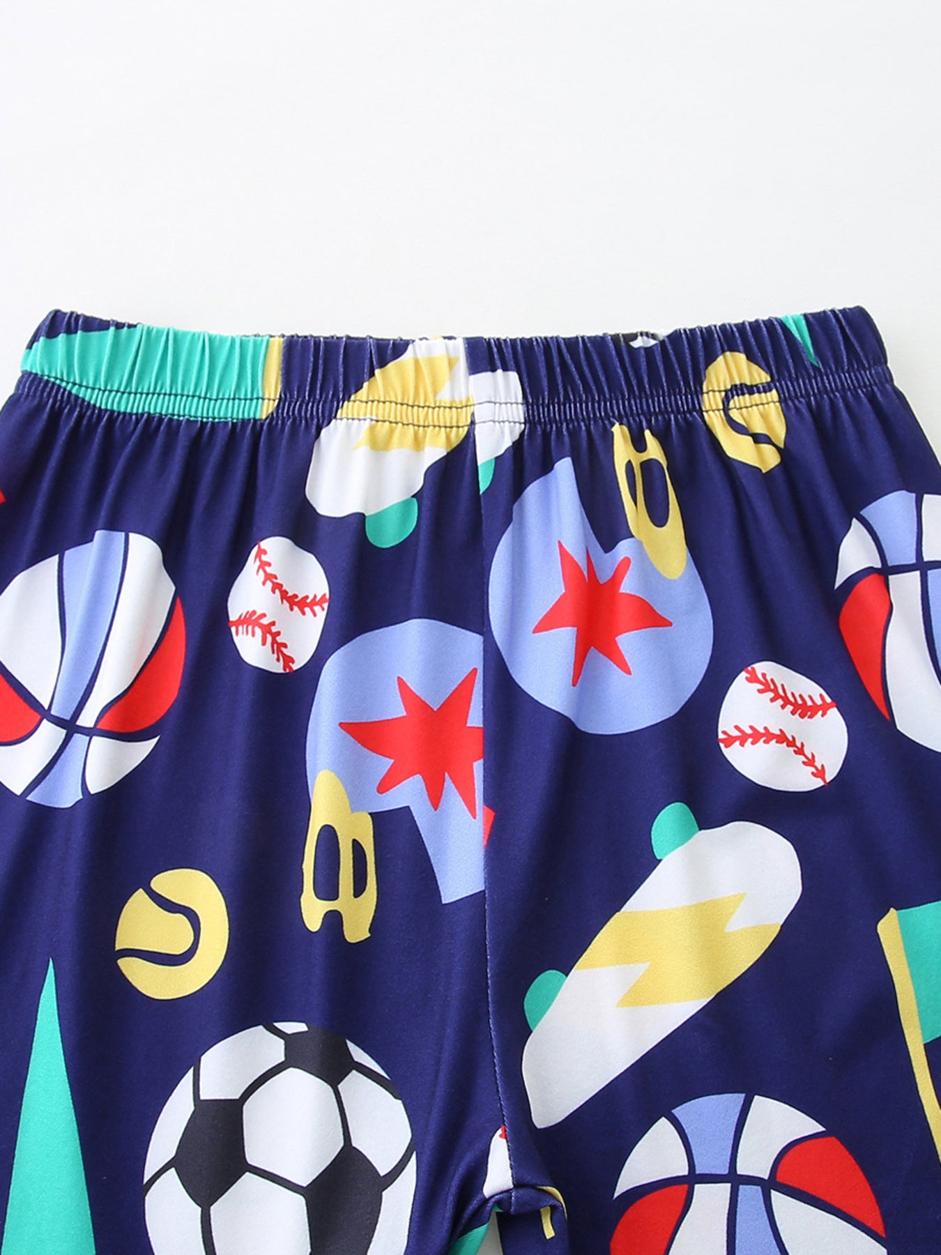 Navy kids shorts with elastic waistband and multicolor sports icon print