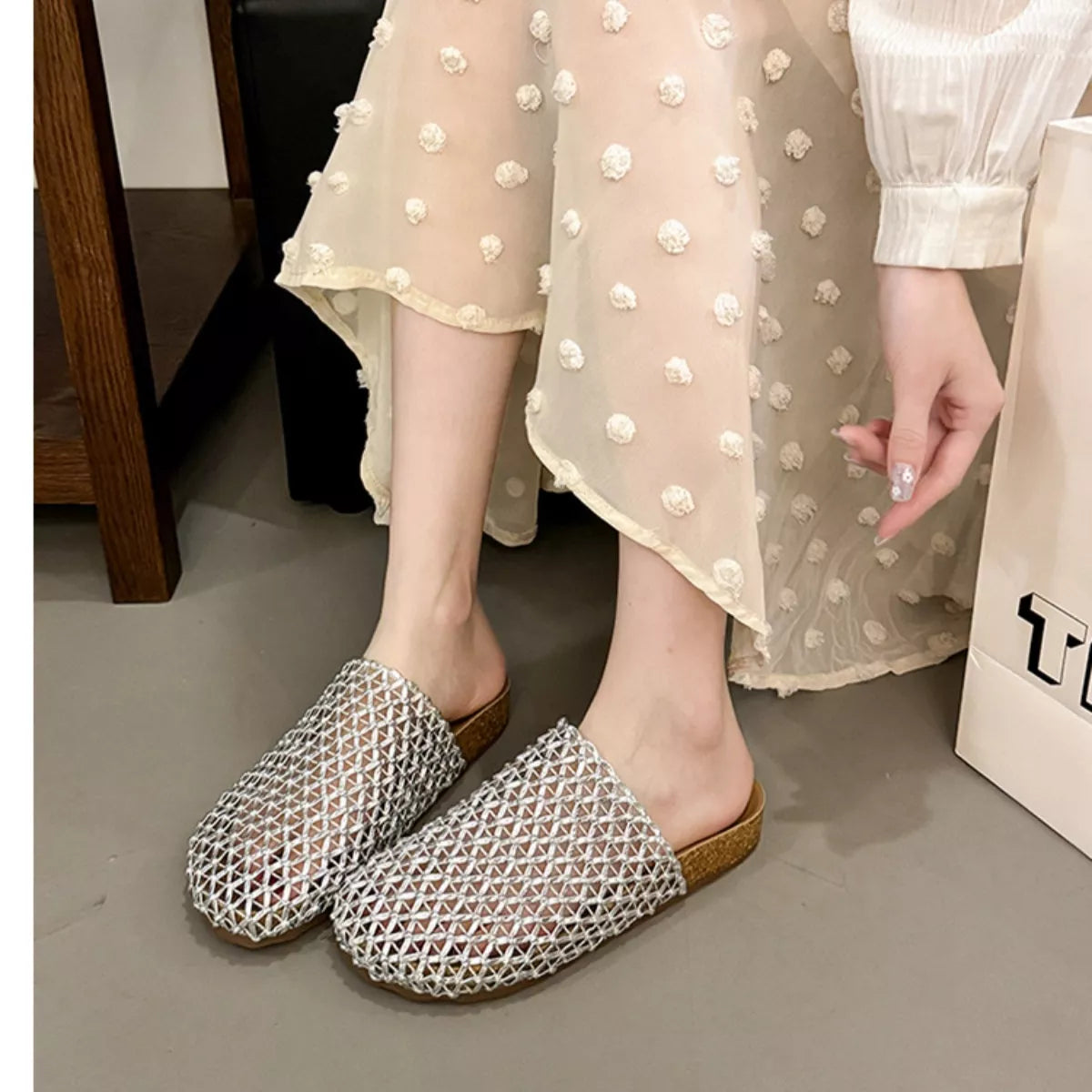 Silver woven mesh slip-on sandals with open toe and open back, crisscross lattice upper