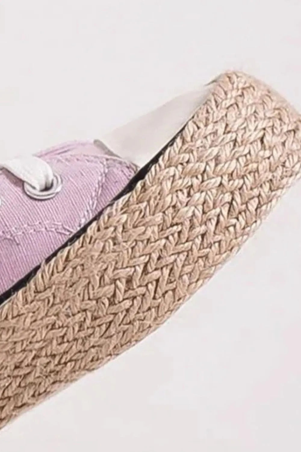 Jute platform outsole detail on lilac lace-up espadrille sneaker