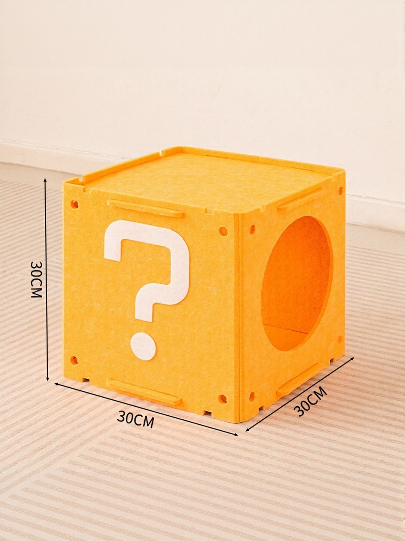 Yellow interactive cat house cube with question-mark cutout and oval entrance
