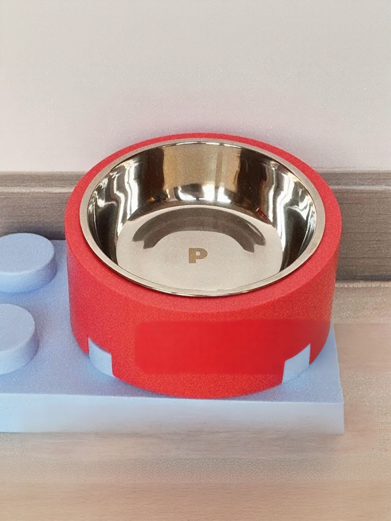 Red food storage bucket with round stainless steel pet bowl