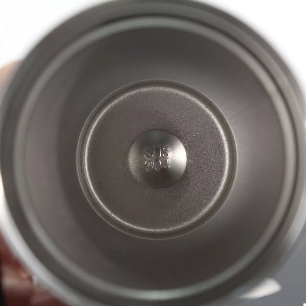 Stainless steel tumbler bottom showing “SUS 304” label