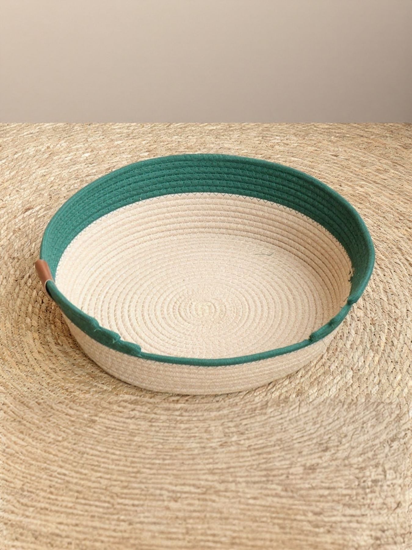 Woven Pet Nest oval basket with green rim and beige woven interior, no cushion shown