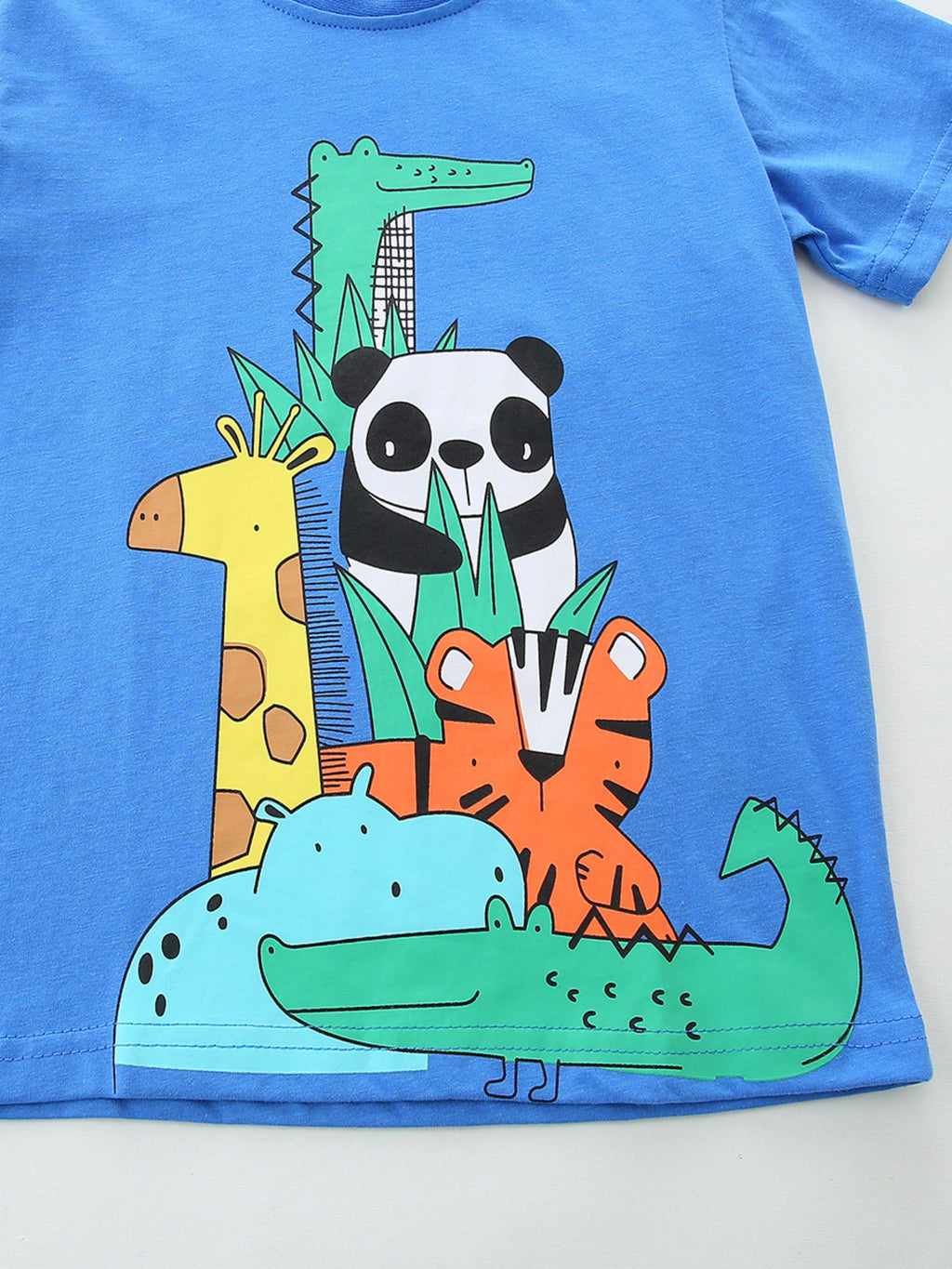 Blue crew neck T-shirt front, colorful animal collage at center hem