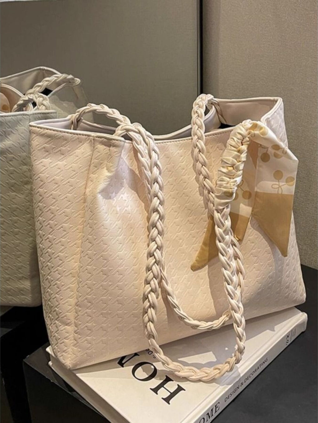 Ivory braided handle tote bag with braided rope handles and ribbon bow detail