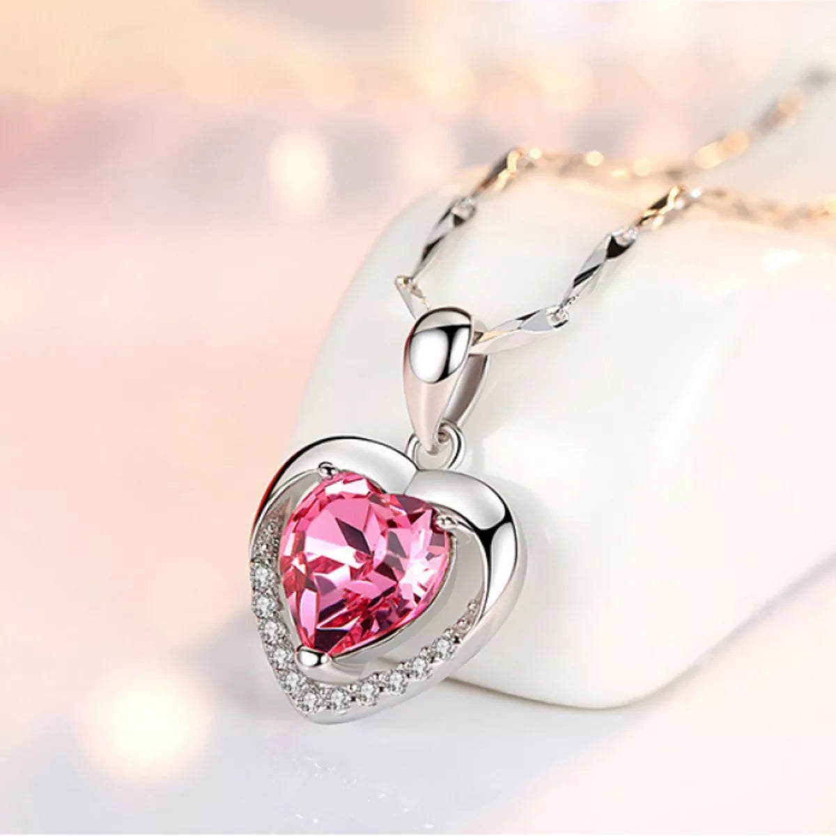 Sterling silver heart pendant with blush pink zircon and pavé edge detail
