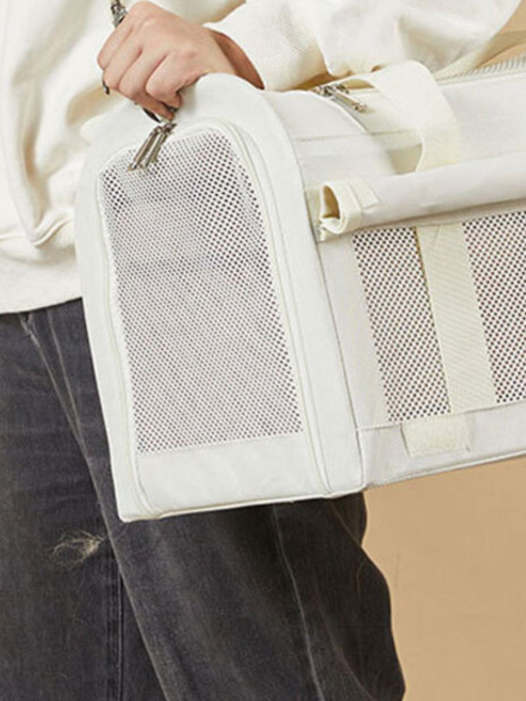 Pet carrier bag side view with large mesh panel for ventilation